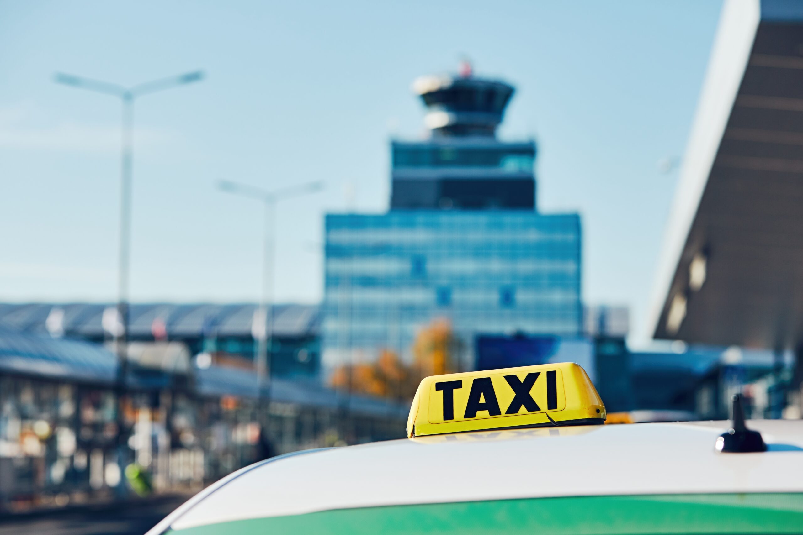 Taxi car on the street in against airport terminal. Prague, Czech Republic